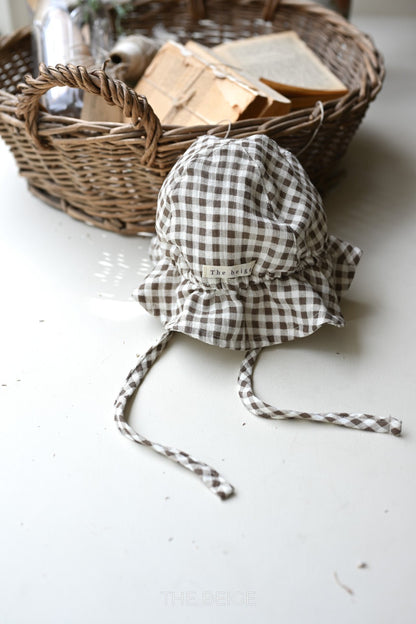 the beige mandu bucket hat