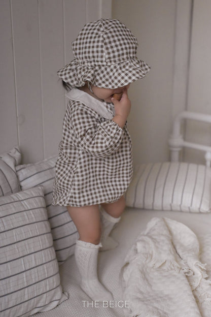 the beige mandu bucket hat