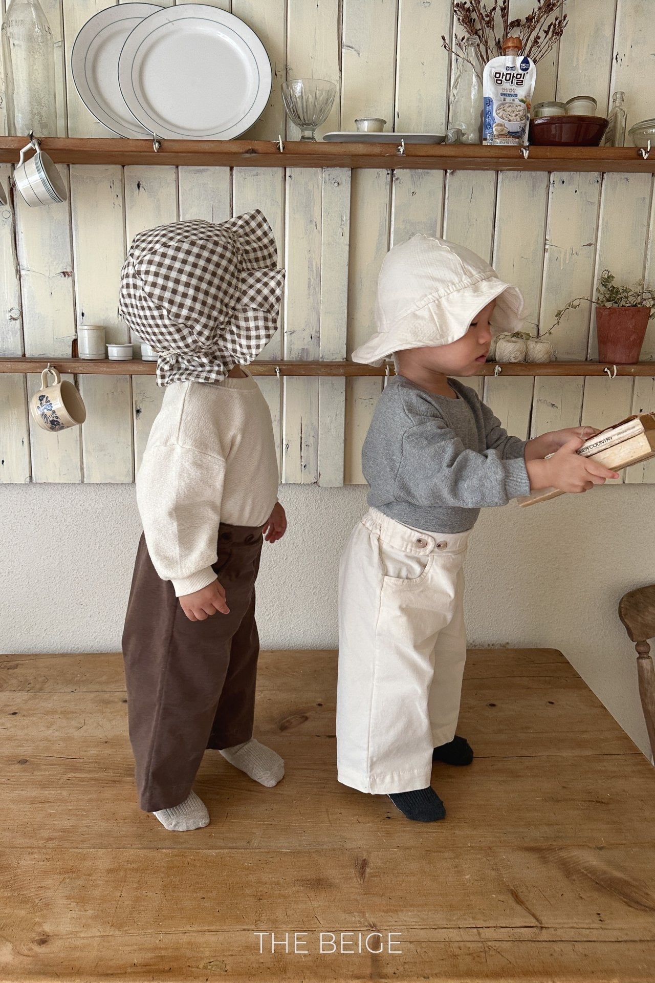 the beige mandu bucket hat