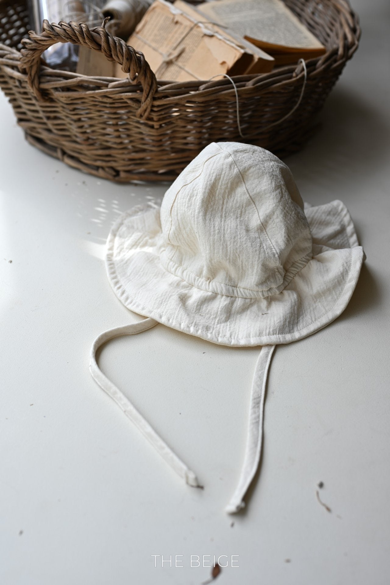 the beige mandu bucket hat