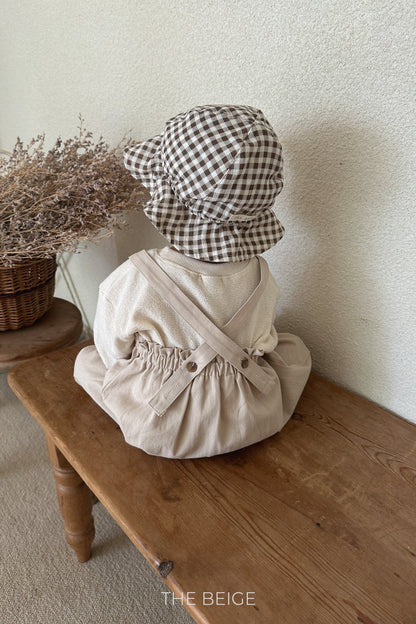 the beige mandu bucket hat